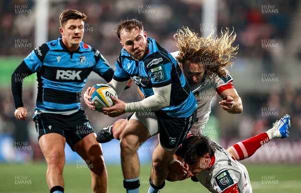 310126 - Ulster v Cardiff Rugby - United Rugby Championship - Ioan Lloyd of Cardiff is tackled Werner Kok, centre, and Ethan McIlroy of Ulster