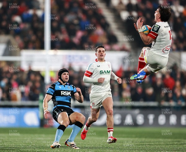 310126 - Ulster v Cardiff Rugby - United Rugby Championship - Ethan McIlroy of Ulster in action against Leigh Halfpenny of Cardiff 