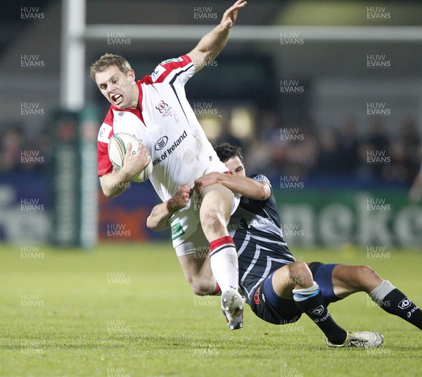 121012 Ulster v Castres - Heineken Cup - Darren Cave of Ulster is tackled by Thierry Lacrampe of Castres 