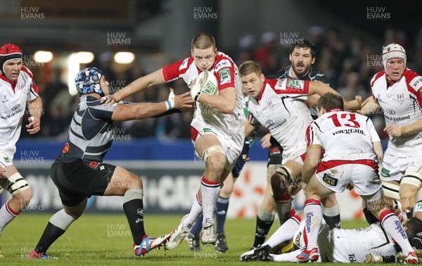 121012 Ulster v Castres - Heineken Cup - Ian Henderson of Ulster breaks the tackle of Michael Coetzee of Castres 