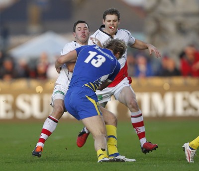 12.11.11  Ulster v Clermont Auvergne.. Paddy Wallace of Ulster tackled by Aurelien Rougerie of Clermont. 