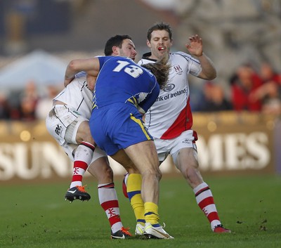 12.11.11  Ulster v Clermont Auvergne.. Paddy Wallace of Ulster tackled by Aurelien Rougerie of Clermont. 