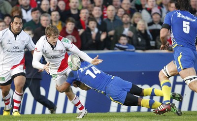 12.11.11  Ulster v Clermont Auvergne.. Andrew Trimble of Ulster tackled by Wesley Fofana of Clermont. 