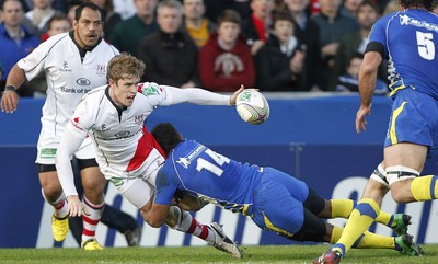 12.11.11  Ulster v Clermont Auvergne.. Andrew Trimble of Ulster tackled by Wesley Fofana of Clermont. 