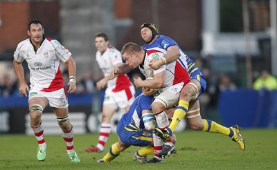 12.11.11  Ulster v Clermont Auvergne.. Tom Court of Ulster tackled by Gerhard Vosloo and Julien Bonnaire of Clermont. 