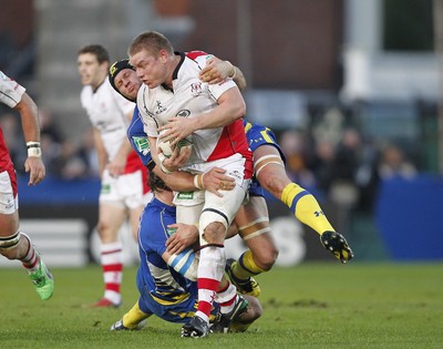 12.11.11  Ulster v Clermont Auvergne.. Tom Court of Ulster tackled by Gerhard Vosloo and Julien Bonnaire of Clermont. 