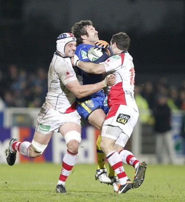 12.11.11  Ulster v Clermont Auvergne... Brock James of Clermont tackled by Dan Tuohy and Paddy Wallace of Ulster. 