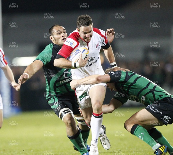 051012 Ulster v Connacht - RaboDirect Pro12 - Paddy Wallace of Ulster is tackled by George Naoupu and Eoin Griffin of Connacht   