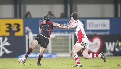 100212 - Ulster v Dragons - RaboDirect Pro 12Adam Hughes of Dragons kicks past Ian Whitten of Ulster