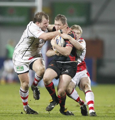 100212 - Ulster v Dragons - RaboDirect Pro 12Dragons' Steve Jones is tackled by Ulster's Callum Black and Nevin Spence