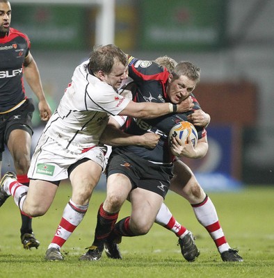 100212 - Ulster v Dragons - RaboDirect Pro 12Dragons' Steve Jones is tackled by Ulster's Callum Black and Nevin Spence