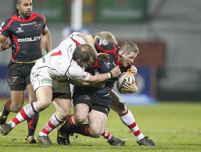 100212 - Ulster v Dragons - RaboDirect Pro 12Dragons' Steve Jones is tackled by Ulster's Callum Black and Nevin Spence