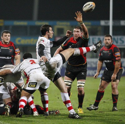 100212 - Ulster v Dragons - RaboDirect Pro 12Dragons' Adam Jones tries to block the clearance kick of Ulster's Ruan Pienaar