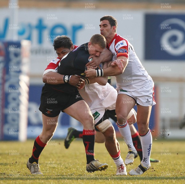 120413 Ulster v Dragons - RaboDirect Pro 12 - Jack Dixon of Dragons is tackled by Ruan Pienaar and Nick Williams of Ulster 