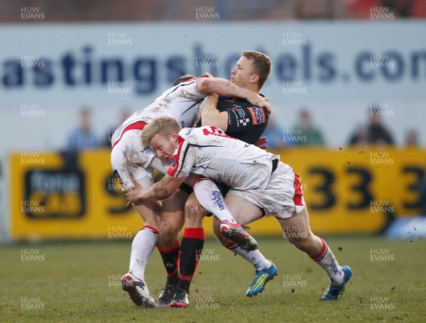 120413 Ulster v Dragons - RaboDirect Pro 12 - Pat Leach of Dragons is tackled by Darren Cave and Stuart Olding of Ulster 