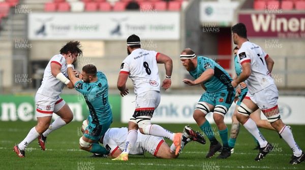 251020 - Ulster v Dragons - Guinness PRO14 - Harrison Keddie of Dragons is tackled by John Andrew, left, and Marty Moore of Ulster