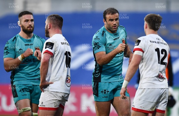 251020 - Ulster v Dragons - Guinness PRO14 - Harrison Keddie, left, and Jamie Roberts of Dragons fist bump with Adam McBurney, left, and Stewart Moore of Ulster