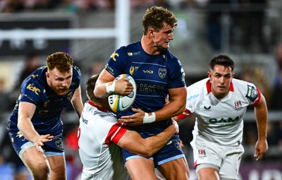260925 - Ulster v Dragons RFC - United Rugby Championship - Joe Westwood of Dragons is tackled by Stuart McCloskey of Ulster