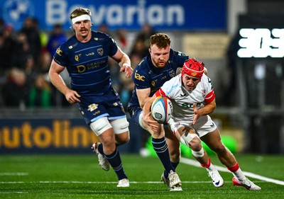 260925 - Ulster v Dragons RFC - United Rugby Championship - Michael Lowry of Ulster is tackled by Aneurin Owen of Dragons