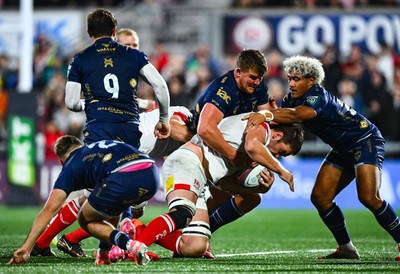 260925 - Ulster v Dragons RFC - United Rugby Championship - Iain Henderson of Ulster is tackled by Shane Lewis-Hughes of Dragons 