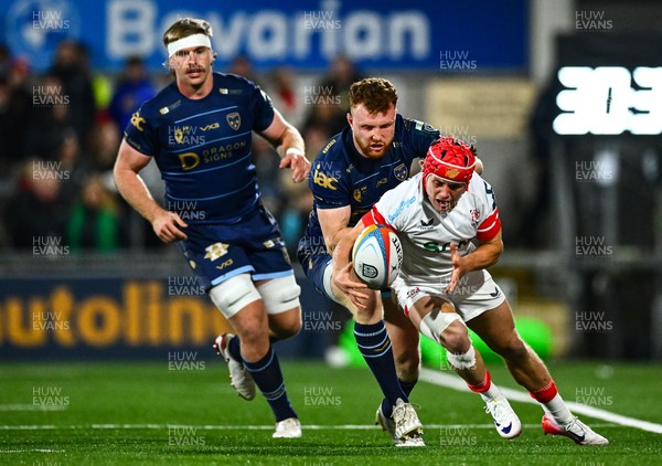 260925 - Ulster v Dragons RFC - United Rugby Championship - Michael Lowry of Ulster is tackled by Aneurin Owen of Dragons