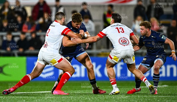 260925 - Ulster v Dragons RFC - United Rugby Championship - Joe Westwood of Dragons is tackled by Ulster players Stuart McCloskey, left, and James Hume 