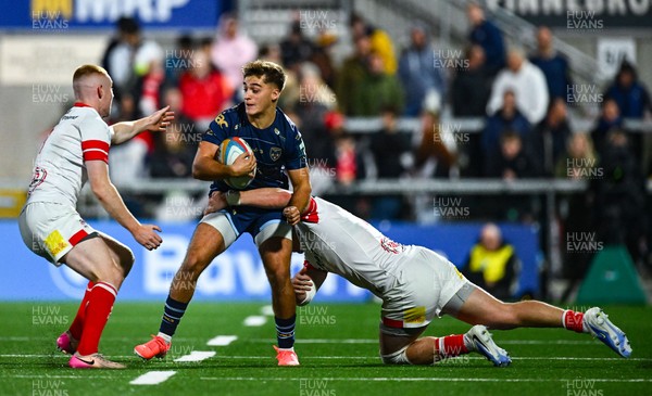 260925 - Ulster v Dragons RFC - United Rugby Championship - Huw Anderson of Dragons is tackled by Zac Ward of Ulster