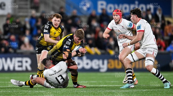 020324 - Ulster v Dragons RFC - United Rugby Championship - Matthew Screech of Dragons is tackled by James Hume of Ulster