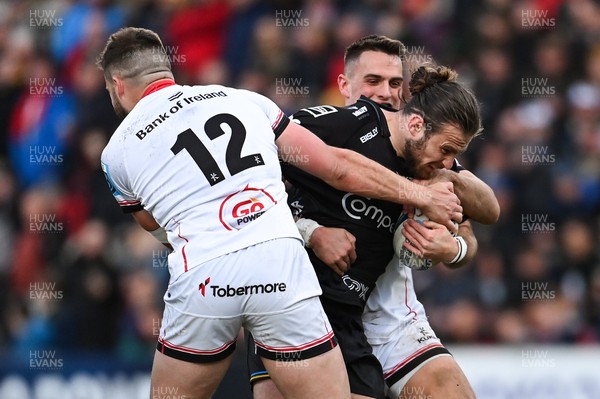 140423 - Ulster v Dragons RFC - United Rugby Championship - Max Clark of Dragons is tackled by Stuart McCloskey, left, and James Hume of Ulster