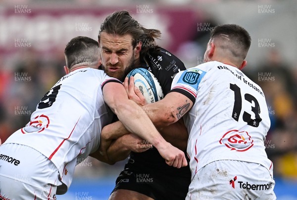 140423 - Ulster v Dragons RFC - United Rugby Championship - Max Clark of Dragons is tackled by John Cooney, left, and James Hume of Ulster