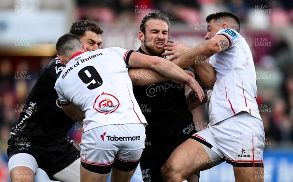 140423 - Ulster v Dragons RFC - United Rugby Championship - Max Clark of Dragons is tackled by John Cooney, left, and James Hume of Ulster