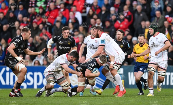 140423 - Ulster v Dragons RFC - United Rugby Championship - Aaron Wainwright of Dragons is tackled by Sam Carter, left, and Duane Vermeulen of Ulster