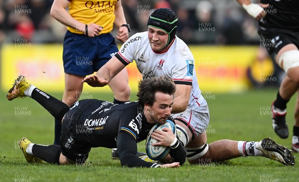 140423 - Ulster v Dragons RFC - United Rugby Championship - Rhodri Williams of Dragons is tackled by Marcus Rea of Ulster