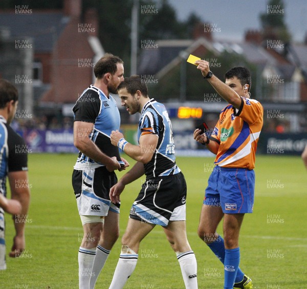 310812 - Ulster v Glasgow Warriors - RaboDirect PRO12 - Tommy Seymour of Glasgow receives yellow from referee Marius Mitrea (FIR) as stand in Captain Graeme Morrison looks on