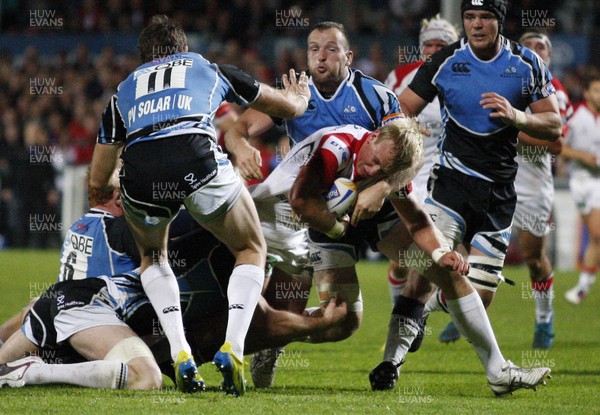 310812 - Ulster v Glasgow Warriors - RaboDirect PRO12 - Luke Marshall of Ulster tries to break through the tackle of Glasgow's Dougie Hall