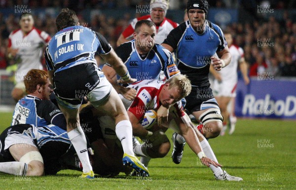 310812 - Ulster v Glasgow Warriors - RaboDirect PRO12 - Luke Marshall of Ulster tries to break through the tackle of Glasgow's Dougie Hall