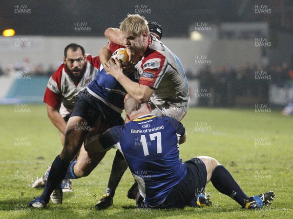 211212 Ulster v Leinster - RaboDirect Pro 12 - Chris Henry of Ulster is tackled by Isaac Boss and Heinke van der Merwe of Leinster 