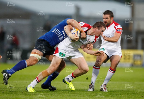 230813 - Ulster v Leinster - Pre-season Friendly - Chris Farrell of Ulster is tackled by  Dominic Ryan of Leinster as Jared Payne supports 