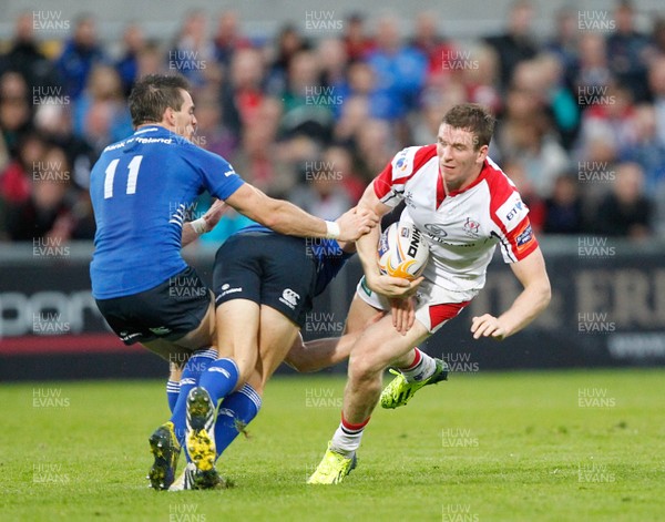 230813 - Ulster v Leinster - Pre-season Friendly - Chris Farrell of Ulster takes on Andrew Boye of Leinster as John Cooney dives in 