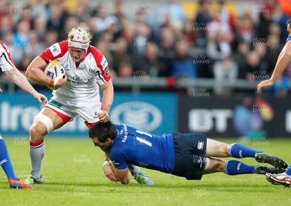 230813 - Ulster v Leinster - Pre-season Friendly - Mike McComish of Ulster is tackled by  Andrew Boyle of Leinster 