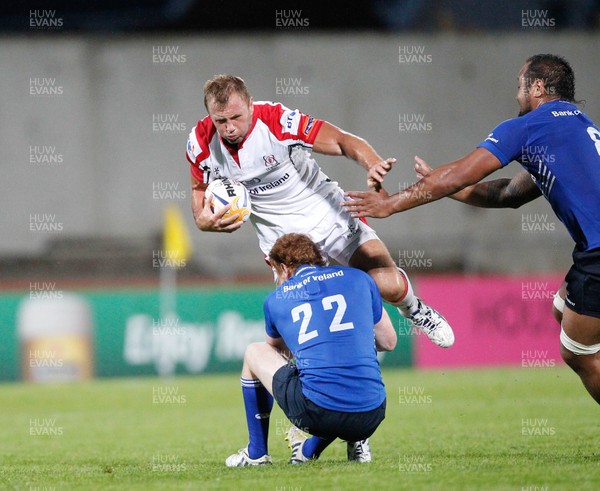 230813 - Ulster v Leinster - Pre-season Friendly - Roger Wilson of Ulster attempts to jump over a possible tackle 