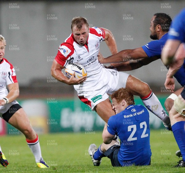 230813 - Ulster v Leinster - Pre-season Friendly - Roger Wilson of Ulster is tackled by the Leinster defence 