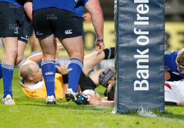 230813 - Ulster v Leinster - Pre-season Friendly - Ian Porter scores the third try for Ulster as referee George Clancy takes a dive in the background 