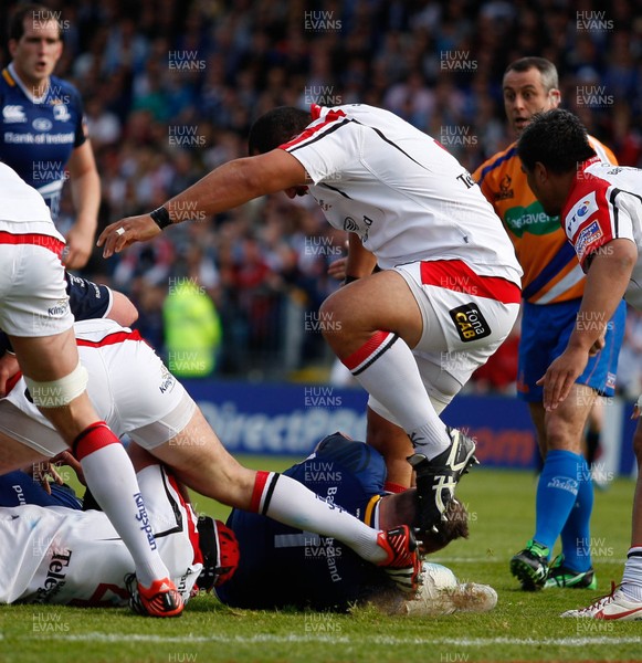 250513 - Ulster v Leinster - RaboDirect Pro 12 -  Cian Healy of Leinster grabs the leg of John Afoa of Ulster, who tries to escape his clutches 