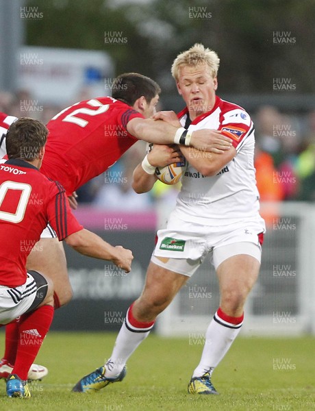 140912  Ulster v Munster - RaboDirect Pro12  Luke Marshall of Ulster tackled by James Downey of Munster as Ian Keatley awaits developments