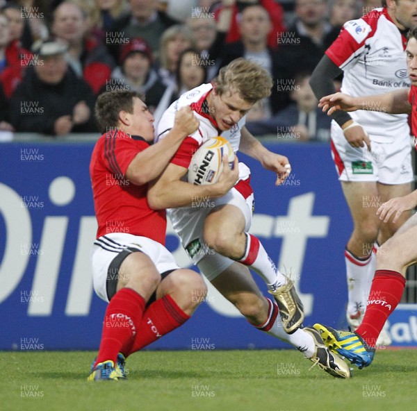 140912  Ulster v Munster - RaboDirect Pro12  Andrew Trimble of Ulster is tackled by Munster's Ian Keatley