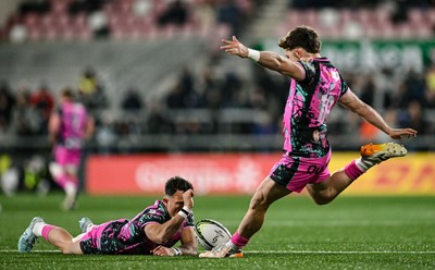 040426 - Ulster v Ospreys - EPCR Challenge Cup Round of 16 - Dan Edwards of Ospreys kicks a conversion, assisted by teammate Luke Morgan,
