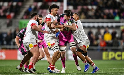 040426 - Ulster v Ospreys - EPCR Challenge Cup Round of 16 - Ryan Smith of Ospreys is tackled by Cormac Izuchukwu, left, and Juarno Augustus of Ulster