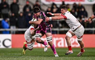 040426 - Ulster v Ospreys - EPCR Challenge Cup Round of 16 - Ryan Smith of Ospreys is tackled by David McCann, left, and Nick Timoney of Ulster