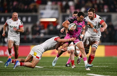 040426 - Ulster v Ospreys - EPCR Challenge Cup Round of 16 - Luke Morgan of Ospreys is tackled by Ethan McIlroy, left, and Iain Henderson of Ulster